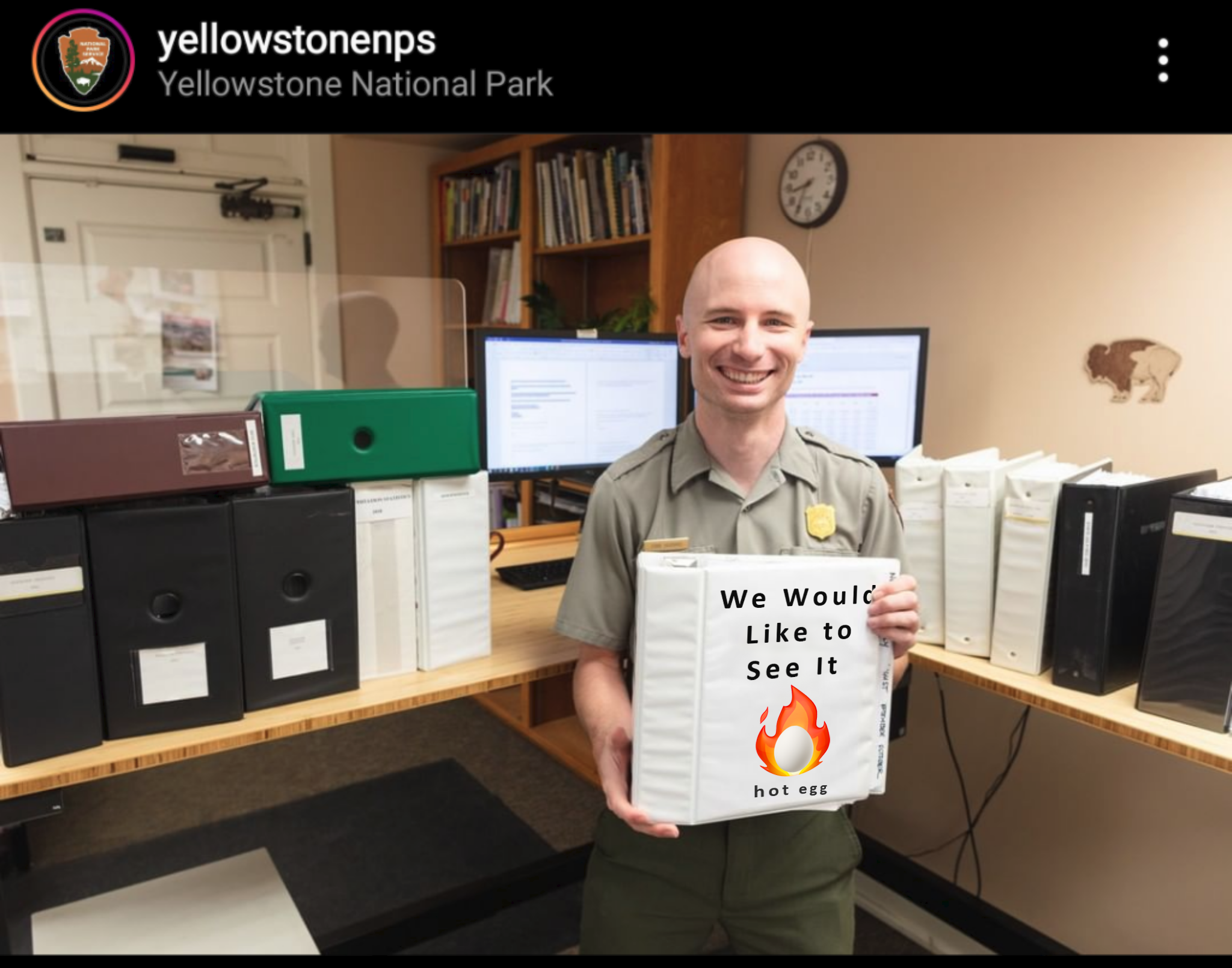 An instagram post from yellowstonenps, a park ranger holds a binder. "Hot Egg We Would Like to See It"
